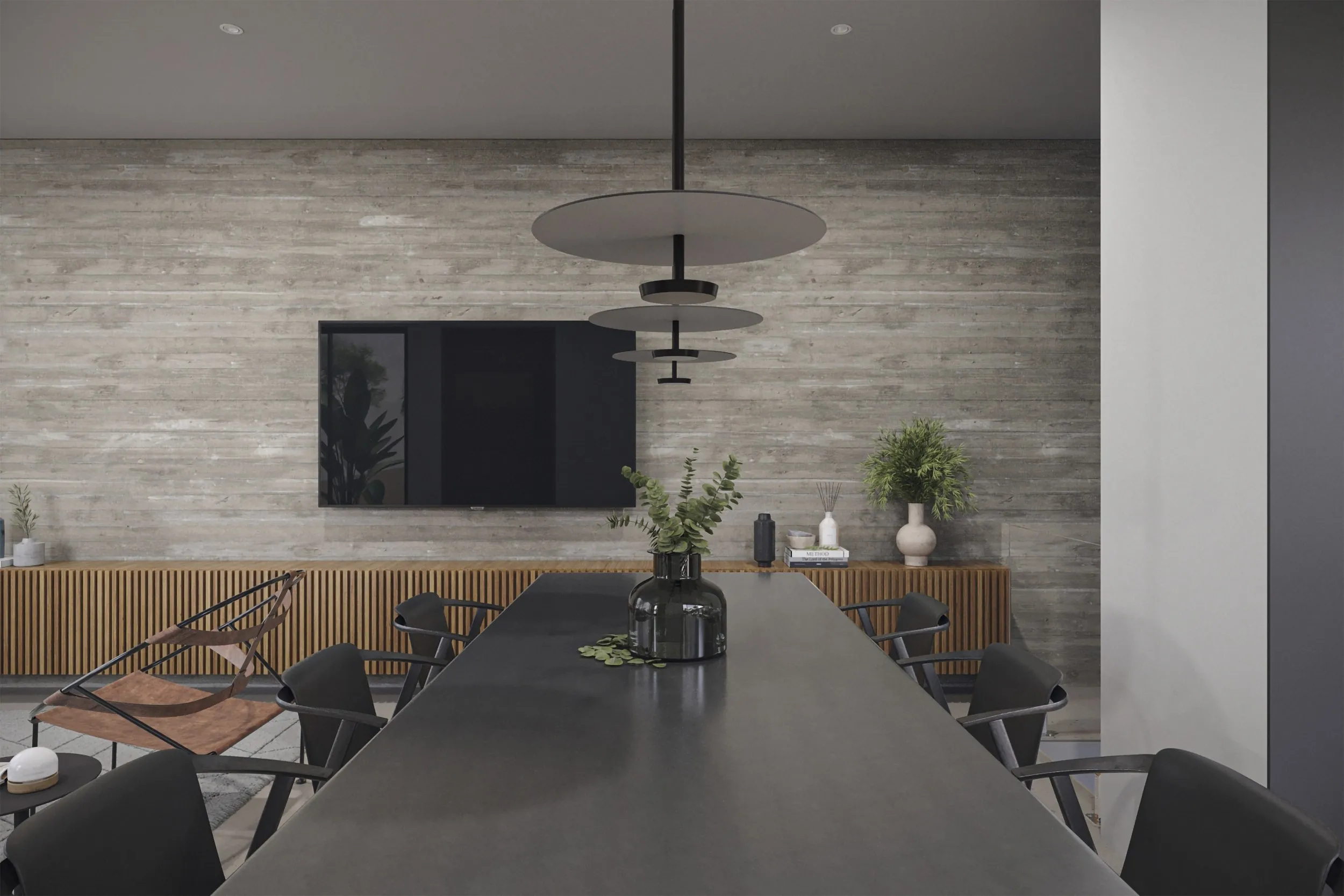 Sala de estar e jantar integradas, com painel de TV e parede de tijolo aparente