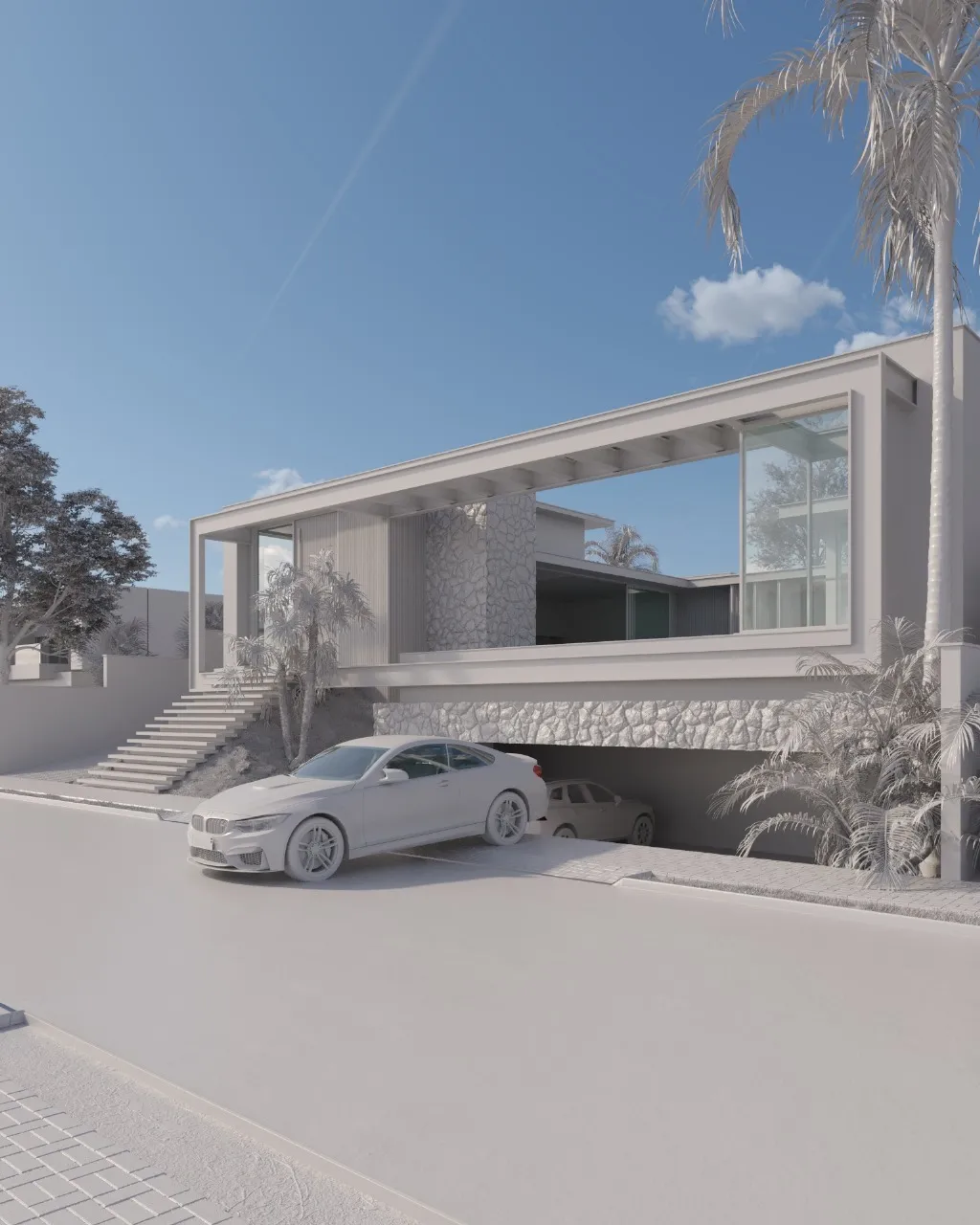 Estudo volumétrico em maquete branca: o volume visto da rua, com a garagem no nível inferior