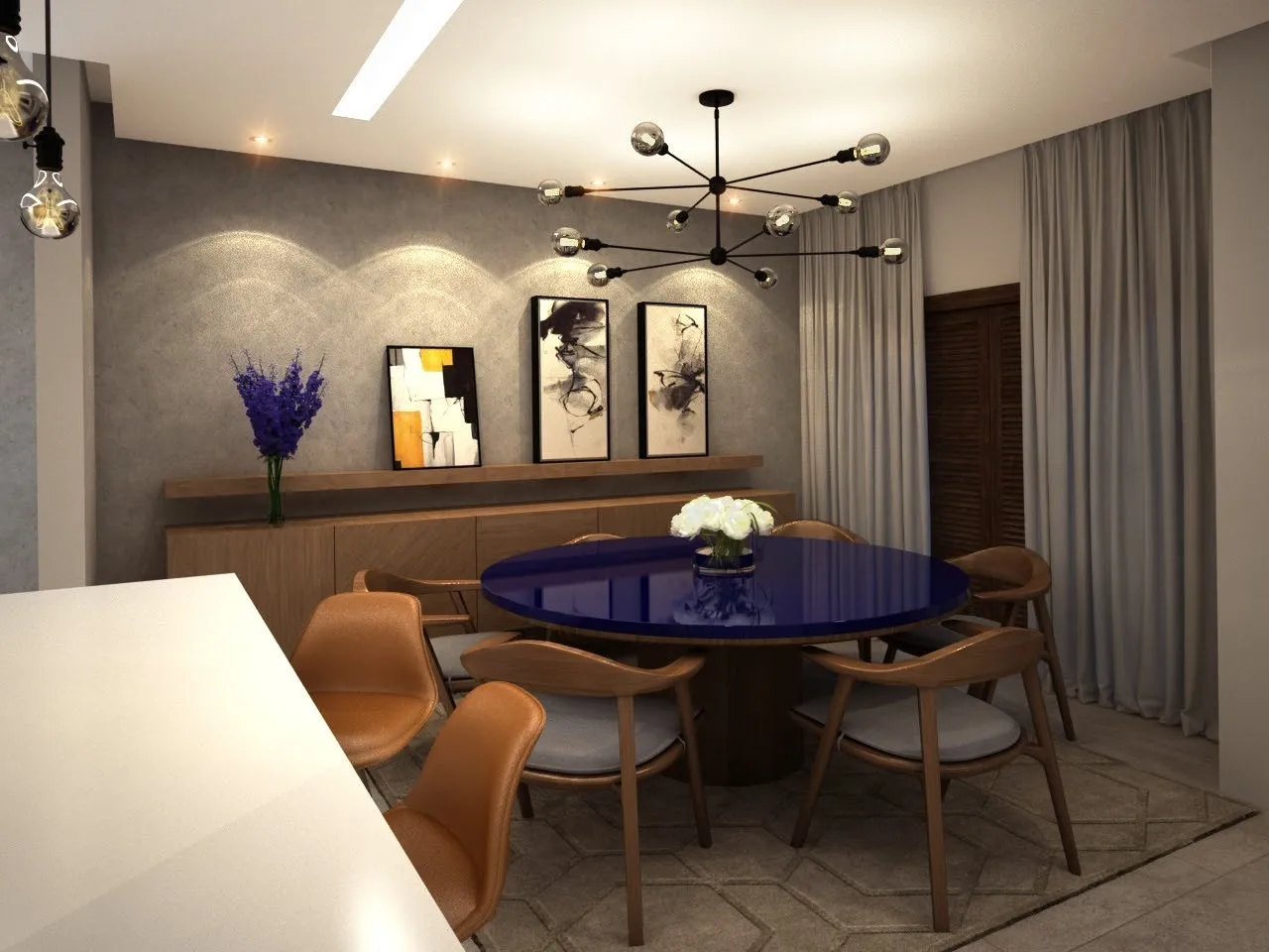 Sala de jantar com mesa oval, cadeiras estofadas e lustre de esferas