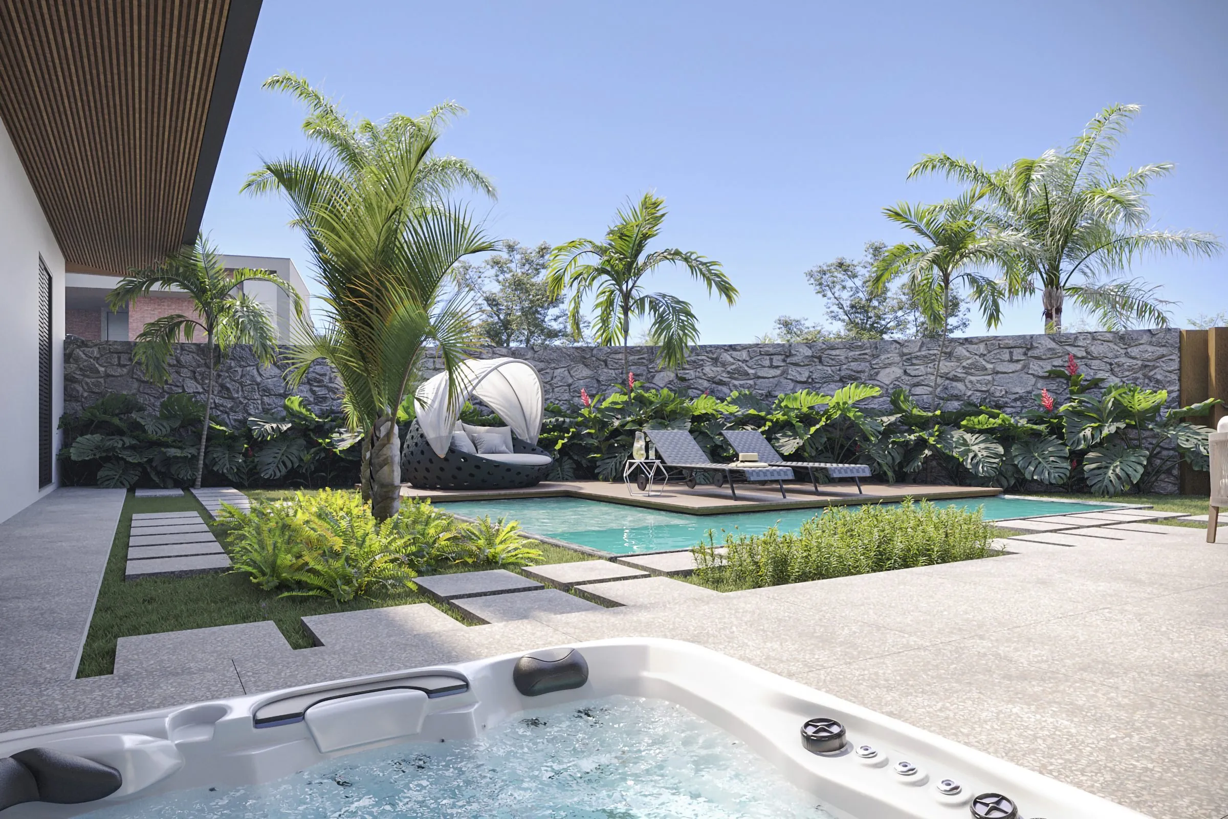 Piscina vista do jardim, com palmeiras e muro de pedra
